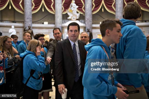 Devin Nunes, a Republican from California and chairman of the House Intelligence Committee, center, walks past visitors in Statuary Hall of the U.S....