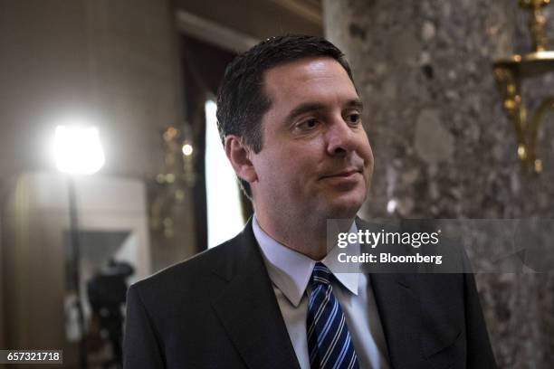 Devin Nunes, a Republican from California and chairman of the House Intelligence Committee, pauses while speaking to Representative Peter King, a...
