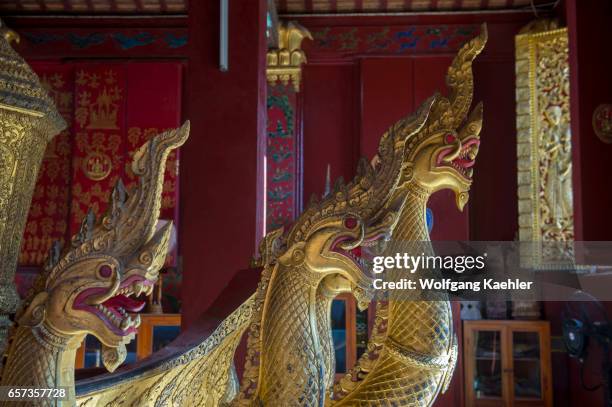 The Chariot Hall or Royal Funerary Chariot Hall at the Wat Xieng Thong in the UNESCO world heritage town of Luang Prabang in Central Laos contains...