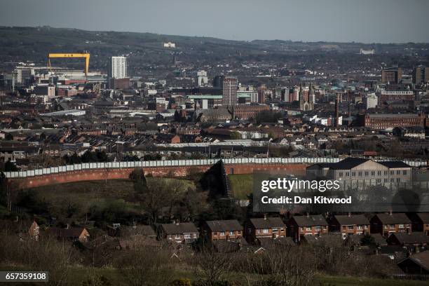 General view of the 'Peace Wall' separating the Catholic and Protestant communities on March 24, 2017 in Belfast, United Kingdom. First built in...