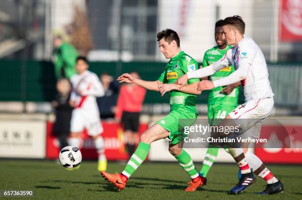 Jonas Hofmann of Borussia Moenchengladbach and Philipp Ziereis of FC St. Pauli battle for the ball during the Friendly Match between Borussia...