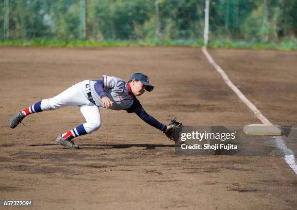 youth baseball players,playing game,catch - baseball ball ストックフォトと画像