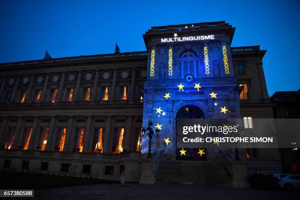 The word Multilingualism is displayed during a light show projected onto the French Foreign Ministry building to celebrate the 60th anniversary of...