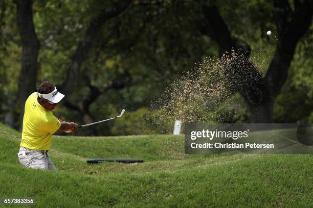 Thongchai Jaidee of Thailand plays a shot from a bunker on the 6th hole of his match during round three of the World Golf Championships-Dell...