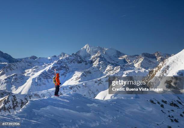 climber with ski on a snowy mountain - glaring meaning stock pictures, royalty-free photos & images