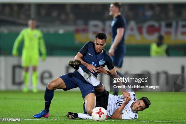 Jacob Murphy of England challenges Nadiem Amiri of Germany during the U21 international friendly match between Germany and England at BRITA-Arena on...