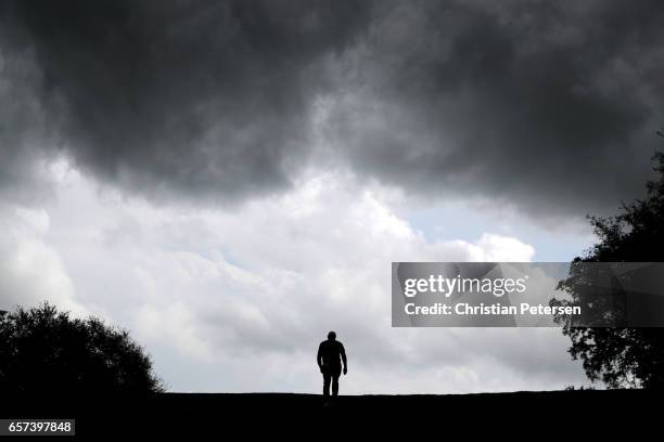 Brooks Koepka walks on the fairway of the 10th hole of his match during round three of the World Golf Championships-Dell Technologies Match Play at...