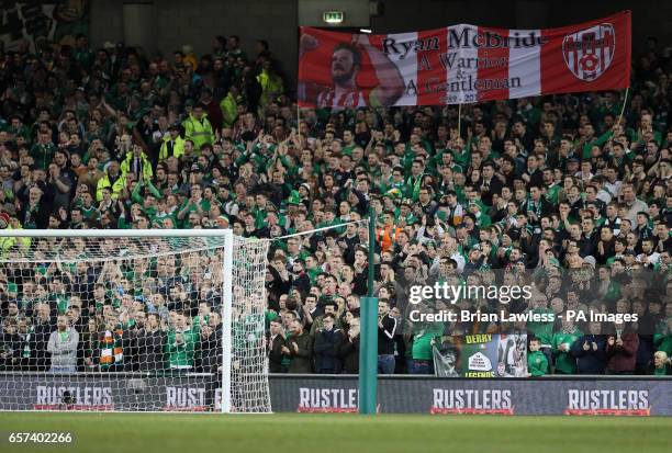 Banner is held up in tribute to Derry City footballer Ryan McBride during the 2018 FIFA World Cup Qualifying, Group D match at the Aviva Stadium,...