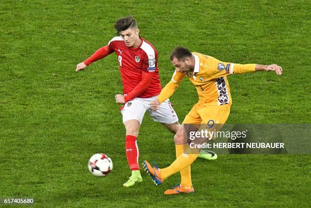 Austria's forward Marcel Sabitzer and Moldavia's Eugeniu Cebotaru vie for the ball during the FIFA World Cup 2018 qualification football match...