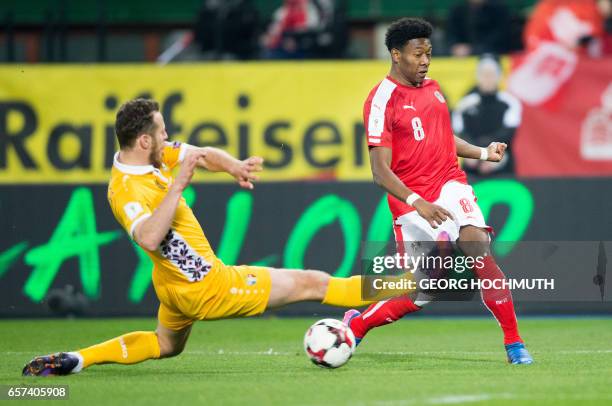 Austria's midfielder David Alaba and Moldavia's Victor Golovatenco vie for the ball during the FIFA World Cup 2018 qualification football match...