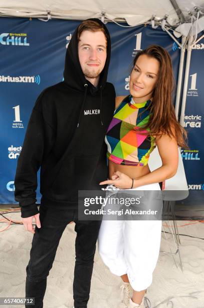 Alan Walkr and artist Gracie attend the event honoring Steve Aoki with a plaque for his single 'Just Hold On' at 1 Hotel & Homes South Beach on March...