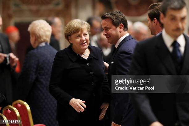 Germany's Chancellor Angela Merkel, Luxembourg's Prime Minister Xavier Bettel and partner Gauthier Destenay attend a meeting with Pope Francis at the...