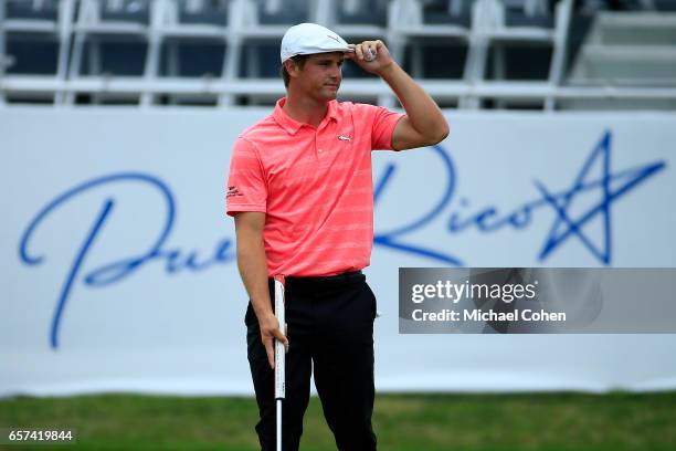 Bryson DeChambeau reacts after making his birdie putt on the 18th green during the second round of the Puerto Rico Open at Coco Beach on March 24,...