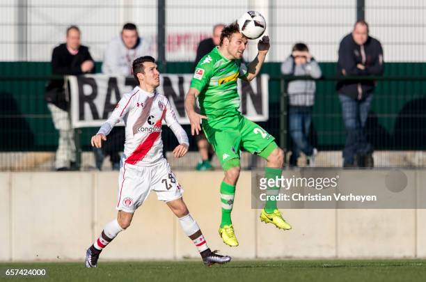 Tony Jantschke of Borussia Moenchengladbach is chased by Waldemar Sobota of FC St. Pauli during the Friendly Match between Borussia Moenchengladbach...