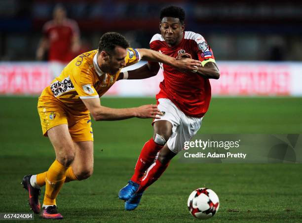 David Alaba of Austria is challenged by Victor Golovatenco of Moldova during the Austria v Moldavia 2018 FIFA World Cup Qualifier match at Ernst...
