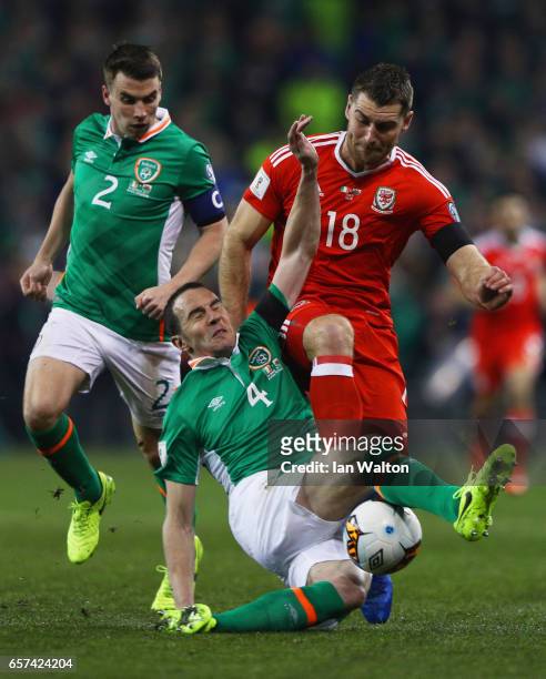 Sam Vokes of Wales battles with John O'Shea and Seamus Coleman of the Republic of Ireland during the FIFA 2018 World Cup Qualifier between Republic...