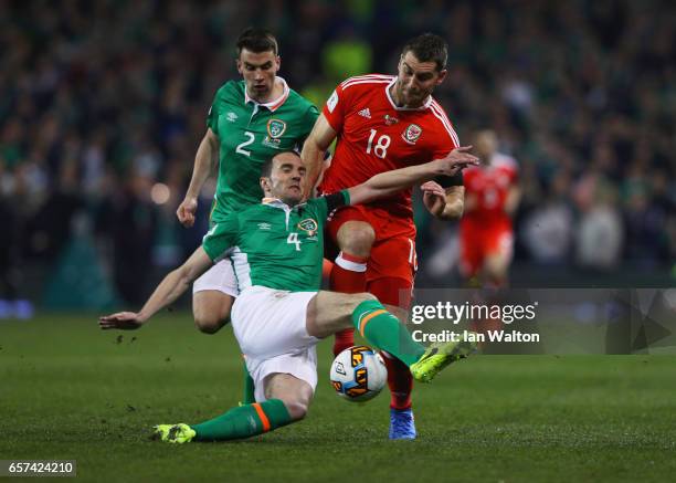 Sam Vokes of Wales battles with John O'Shea and Seamus Coleman of the Republic of Ireland during the FIFA 2018 World Cup Qualifier between Republic...