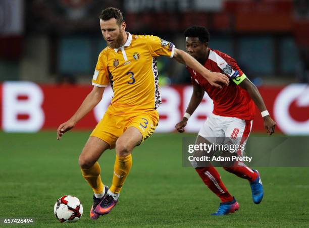 David Alaba of Austria challenges Victor Golovatenco of Moldova during the Austria v Moldavia 2018 FIFA World Cup Qualifier match at Ernst Happel...