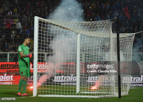 Thomas Strakosha Of Albania looks on as fireworks are thrown onto the pitch during the FIFA 2018 World Cup Qualifier between Italy and Albania at...