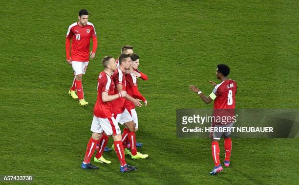 Austria's players celebrates after scoring the 1-0 goal during the FIFA World Cup 2018 qualification football match between Austria and Moldova at...