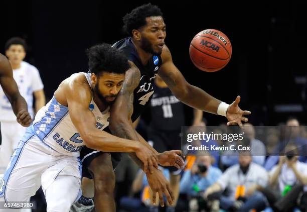 Joel Berry II of the North Carolina Tar Heels collides with Tyler Wideman of the Butler Bulldogs in the first half during the 2017 NCAA Men's...