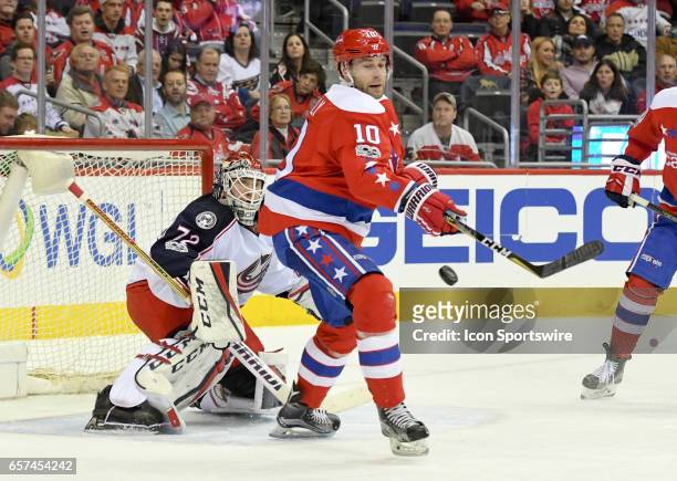 Columbus Blue Jackets goalie Sergei Bobrovsky makes a first period save as Washington Capitals right wing Brett Connolly tries to redirect the puck...