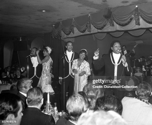 Marilyn McCoo, Florence LaRue, Billy Davis, Jr., LaMonte McLemore, and Ron Townson of the vocal group "5th Dimension" perform onstage at the...