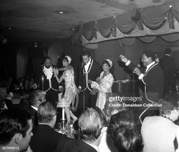 Marilyn McCoo, Florence LaRue, Billy Davis, Jr., LaMonte McLemore, and Ron Townson of the vocal group "5th Dimension" perform onstage at the...