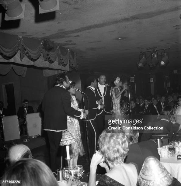 Marilyn McCoo, Florence LaRue, Billy Davis, Jr., LaMonte McLemore, and Ron Townson of the vocal group "5th Dimension" perform onstage at the...