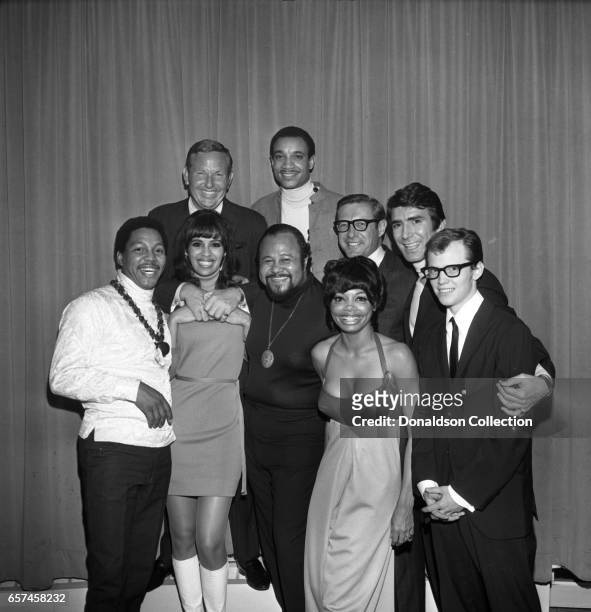 Marilyn McCoo, Florence LaRue, Billy Davis, Jr., LaMonte McLemore, and Ron Townson of the vocal group "5th Dimension" pose at the Americana Hotel on...