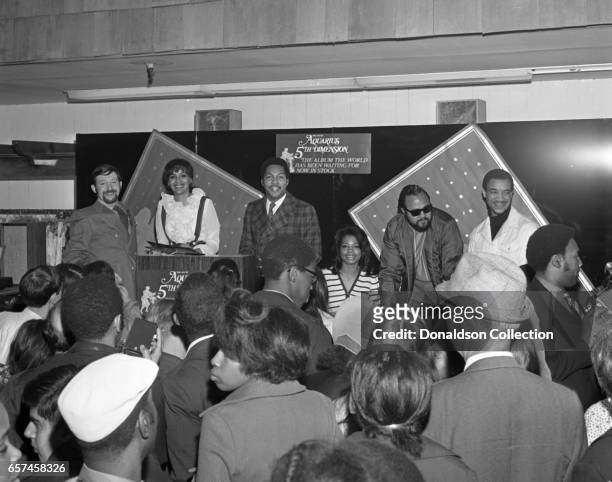 Marilyn McCoo, Florence LaRue, Billy Davis, Jr., LaMonte McLemore, and Ron Townson of the vocal group "5th Dimension" visit Korvettte's Record Store...