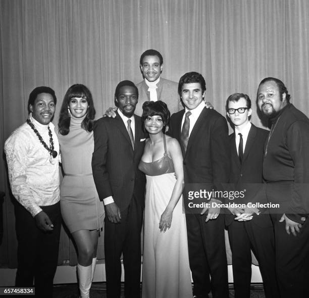 Marilyn McCoo, Florence LaRue, Billy Davis, Jr., LaMonte McLemore, and Ron Townson of the vocal group "5th Dimension" pose at the Americana Hotel on...