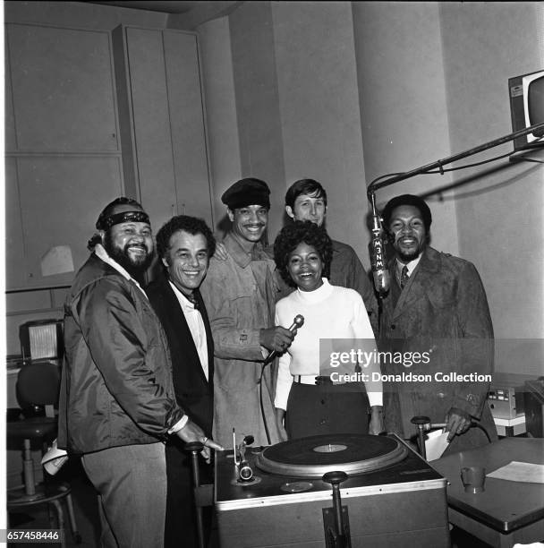 Marilyn McCoo, Florence LaRue, Billy Davis, Jr., LaMonte McLemore, and Ron Townson of the vocal group "5th Dimension" visit radio station WNEW on...