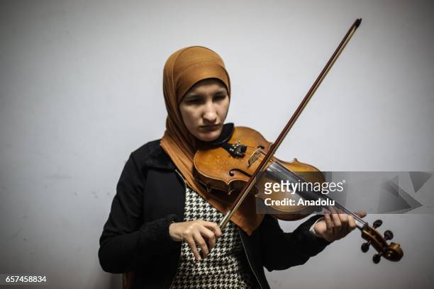 Partially-sighted women use musical instruments as they receive music education in Cairo, Egypt on March 24, 2017.