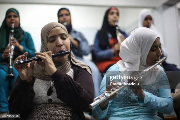 Partially-sighted women use musical instruments as they receive music education in Cairo, Egypt on March 24, 2017.