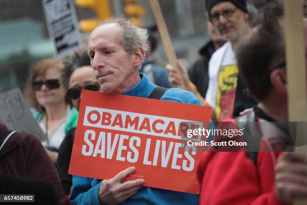 Demonstrators gather near Trump Tower to celebrate the defeat of President Donald Trump's revision of the Affordable Care Act on March 24, 2017 in...