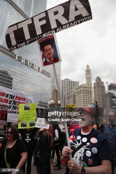 Demonstrators gather near Trump Tower to celebrate the defeat of President Donald Trump's revision of the Affordable Care Act on March 24, 2017 in...