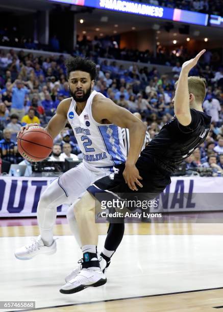 Joel Berry II of the North Carolina Tar Heels dribbles around Tyler Lewis of the Butler Bulldogs in the first half during the 2017 NCAA Men's...