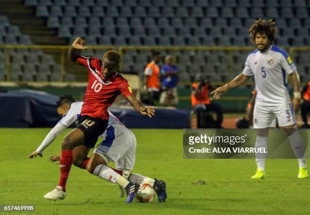 Trinidad and Tobago's midfielder Kevin Molino vies for the ball with Panama's midfielder Amilcar Henriquez during their 2018 FIFA World Cup qualifier...