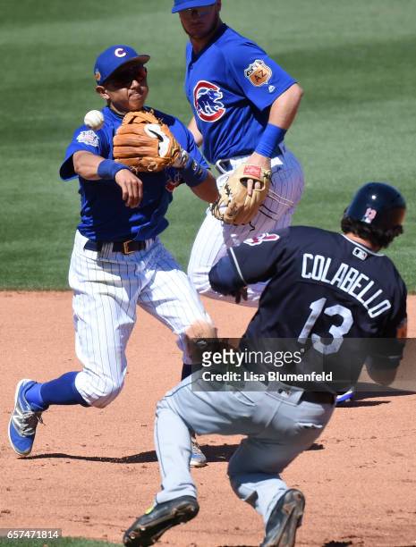 Chris Colabello of the Cleveland Indians is out at second base in the fifth inning against Munenori Kawasaki of the Chicago Cubs during a spring...