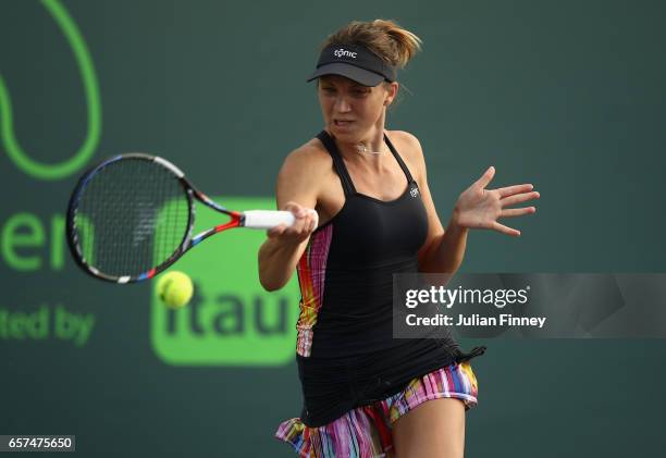 Patricia Maria Tig of Romania in action against Kristina Mladenovic of France at Crandon Park Tennis Center on March 24, 2017 in Key Biscayne,...