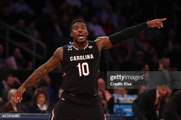 Duane Notice of the South Carolina Gamecocks celebrates a three point basket in the first half against the Baylor Bears during the 2017 NCAA Men's...
