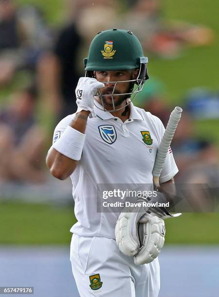 Jean-Paul Duminy of South Africa leaves the field after being caught by Jeetan Patel of New Zealand during day one of the Test match between New...