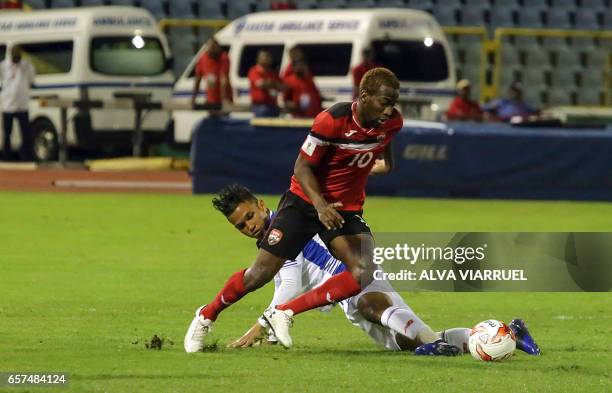 Trinidad and Tobago's midfielder Kevin Molino tries to control the ball past Panama's midfielder Amilcar Henriquez during their 2018 FIFA World Cup...