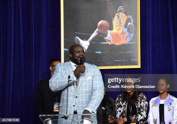 Former Los Angeles Lakers player Shaquille O'Neal speaks after unveiling of his statue while his children look on at Staples Center March 24 in Los...