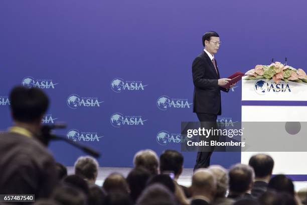 Zhang Gaoli, China's vice premier, arrives on stage to speak during the opening ceremony of the Boao Forum for Asia Annual Conference 2017 in Boao,...