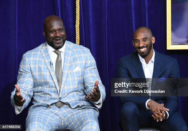 Former Los Angeles Lakers player Shaquille O'Neal reacts to his former players seated in the audience with Kobe Bryant looking on during unveiling of...