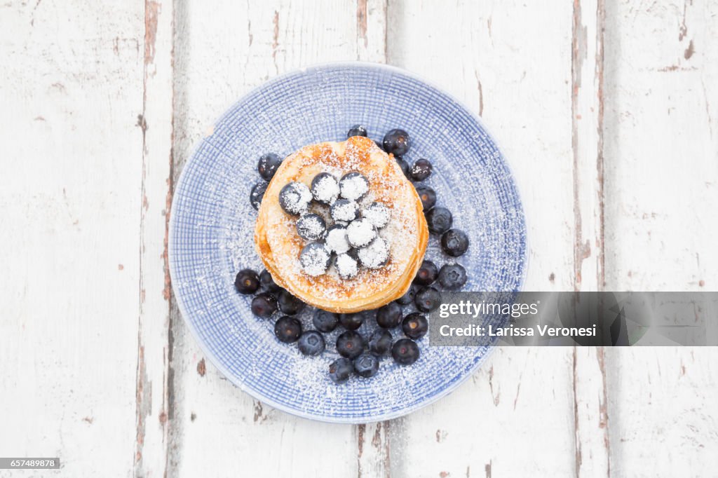 Stack of Pancakes with blueberries on plate