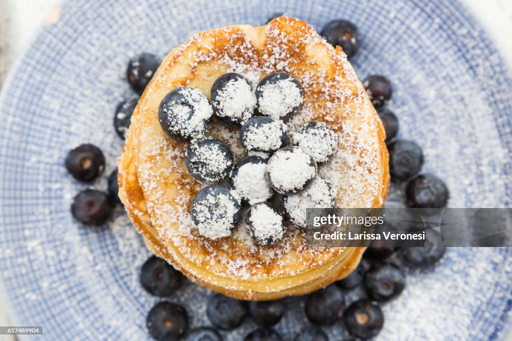 Stack of Pancakes with blueberries on plate