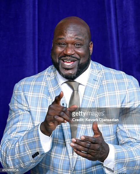 Former Los Angeles Lakers player Shaquille O'Neal reacts to his former players seated in the audience during unveiling of his statue at Staples...